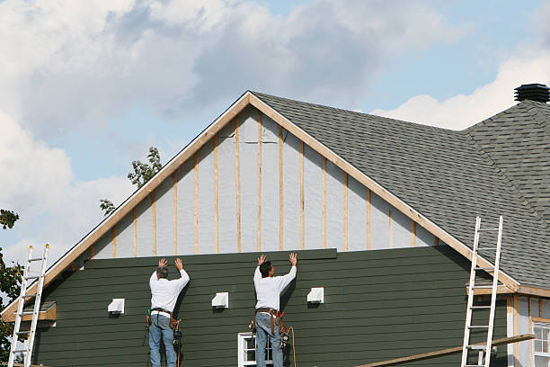 Professional Storm Damage Siding Repair technician working in Durham, CT